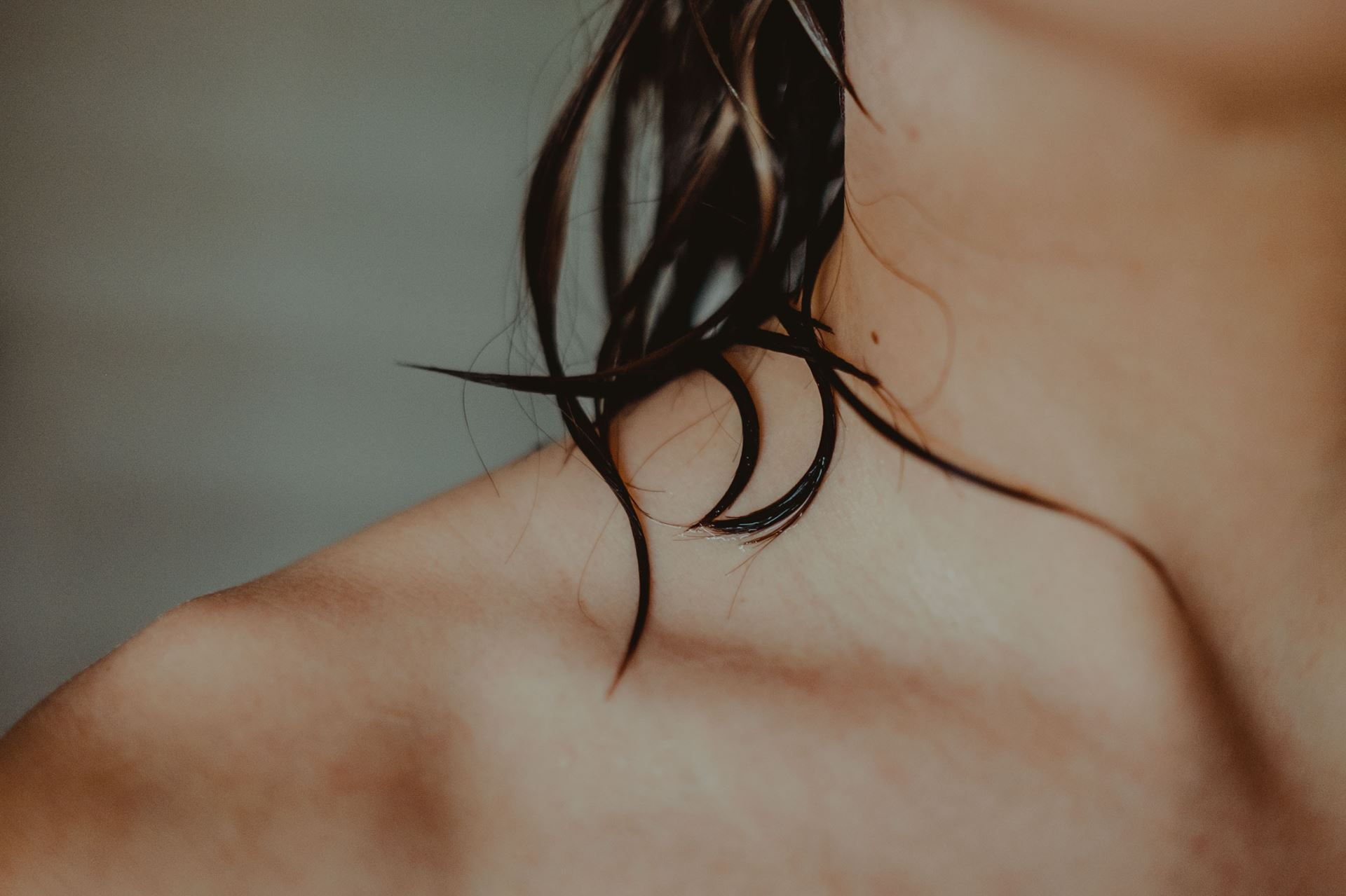 a close up of a persons neck and shoulder